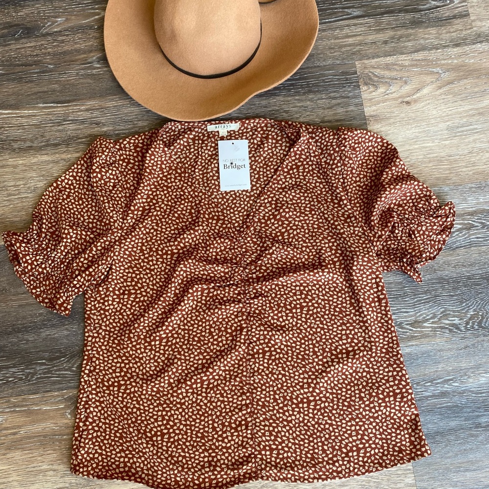 Sz L, brand Arrays at no rest for Brigit, brand new with tags,  side zip blouse.